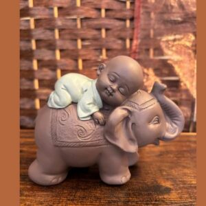 Bonze endormi sur éléphant